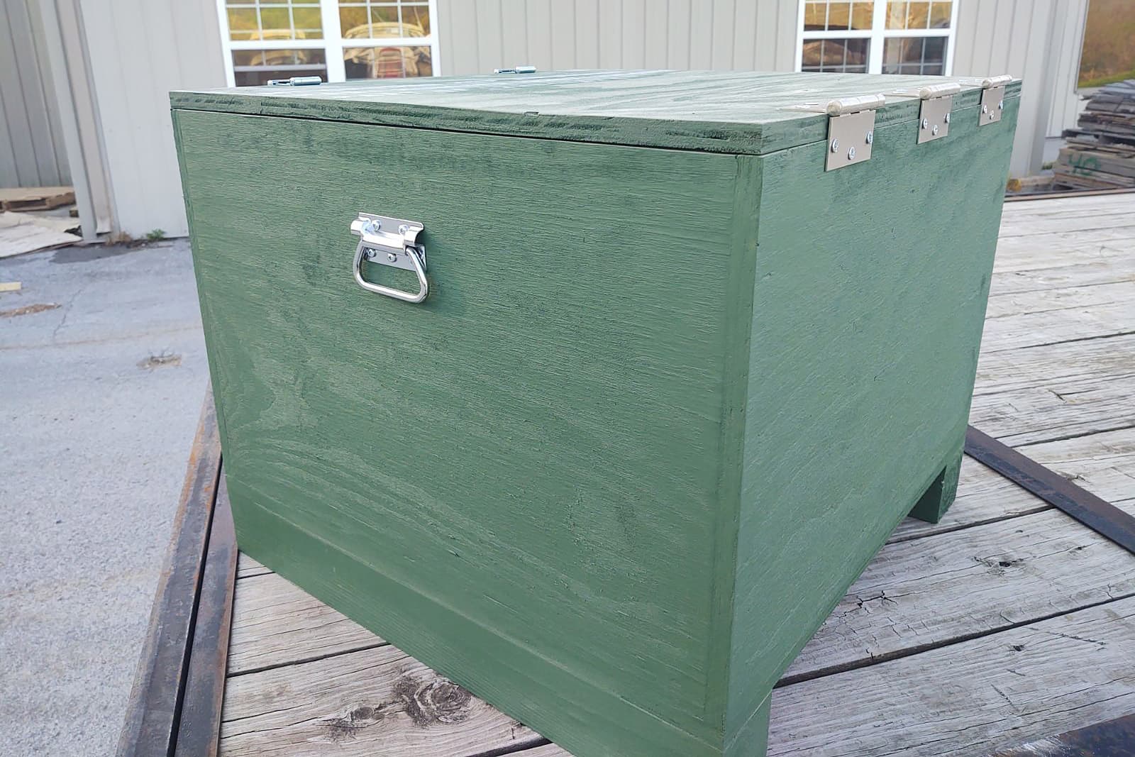 IPCS custom wood crate with green paint and metal handles